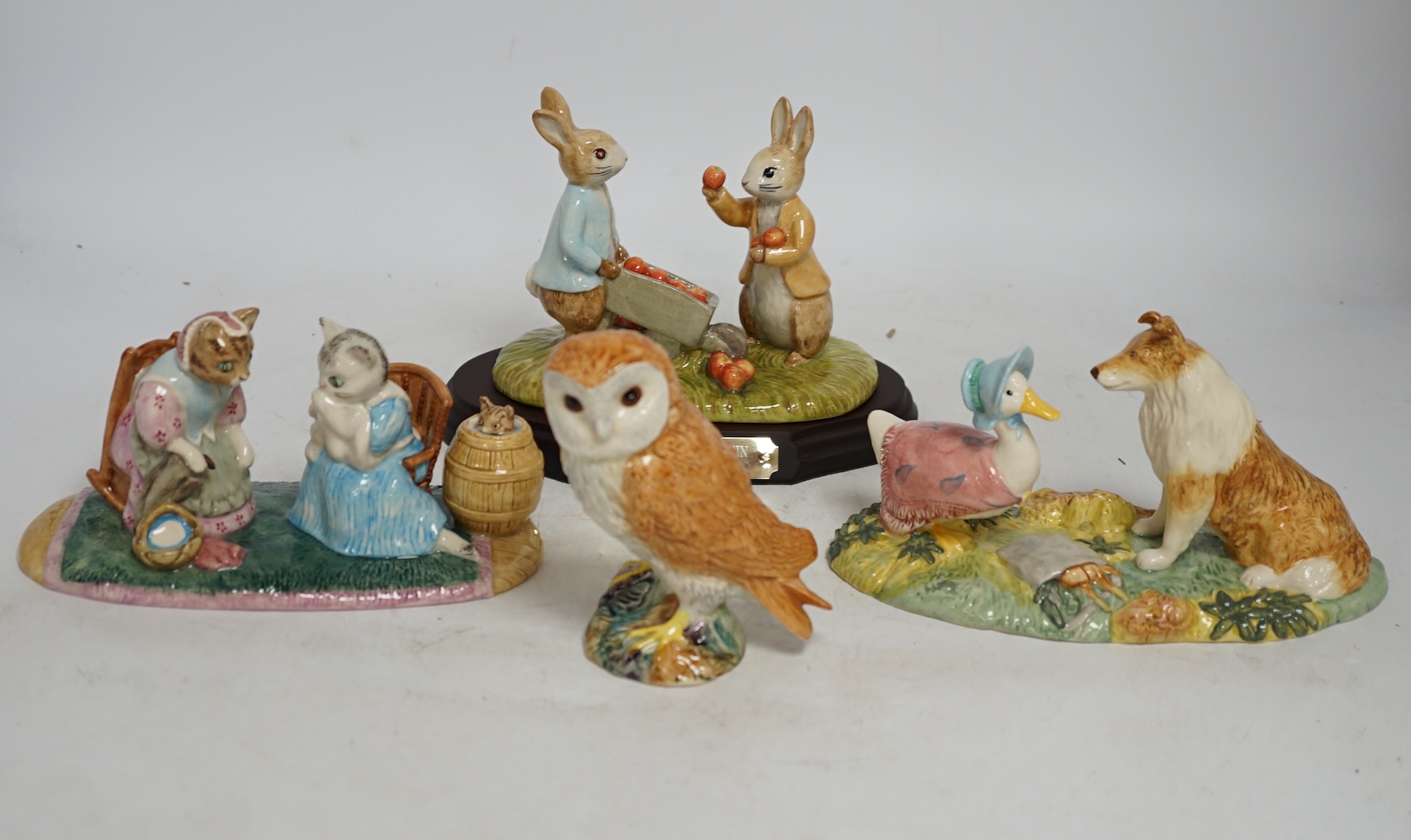 Eight John Beswick figures, mostly Beatrix Potter including Dear Son Thomas, Ginger & Pickles and Two Gentleman, all boxed. Condition - good